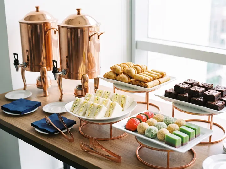 Corporate tea break with copper urns, kueh and brownies