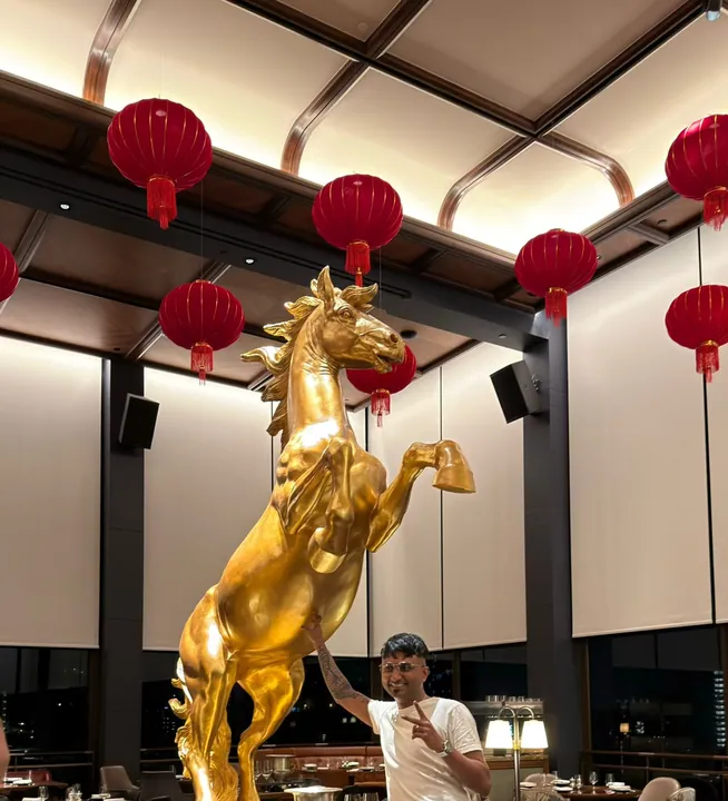 Chinese New Year 2026 · Year of the Horse: Gold horse centrepiece under red lanterns for the Year of the Horse