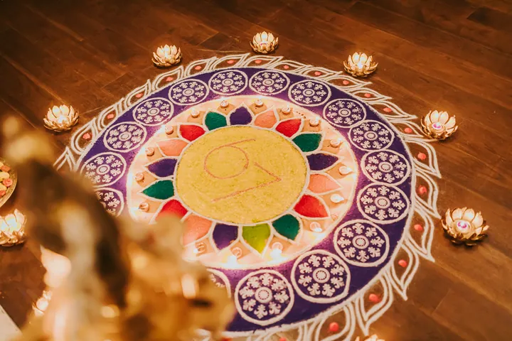 Diwali 2024: Floor rangoli carrying the club's 67 mark, ringed with lotus tealights