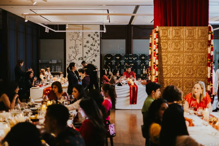 Diwali 2025: Dinner in the main room, the gold panel and drapes behind