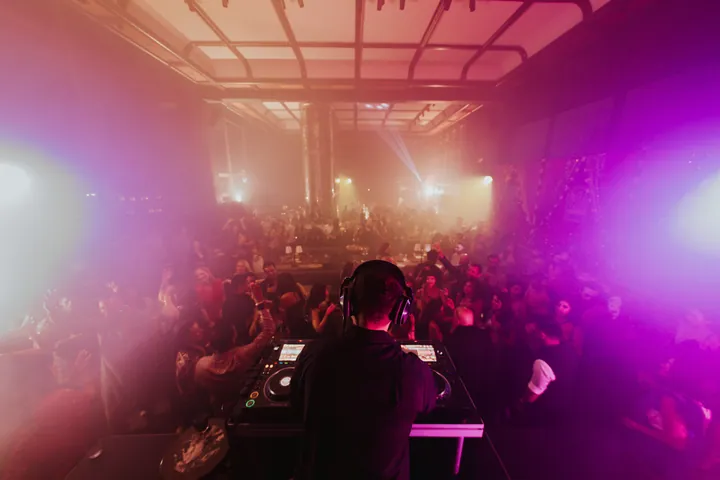 Diwali 2025: The room from the booth: pink haze and beams