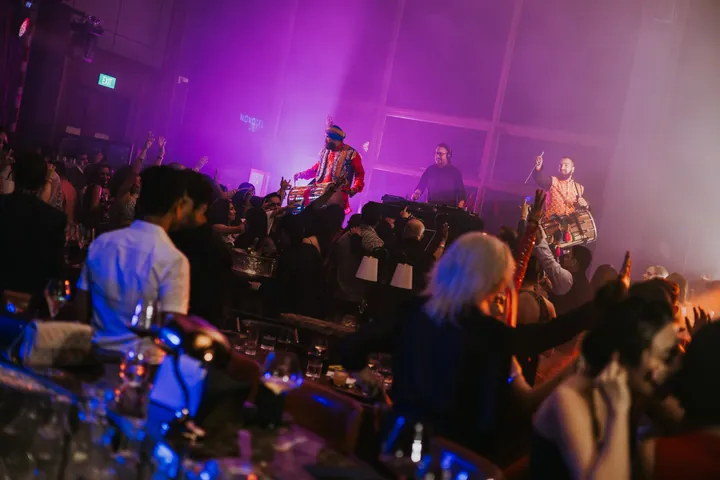 Diwali 2025: Dhol players on the raised stage above the crowd