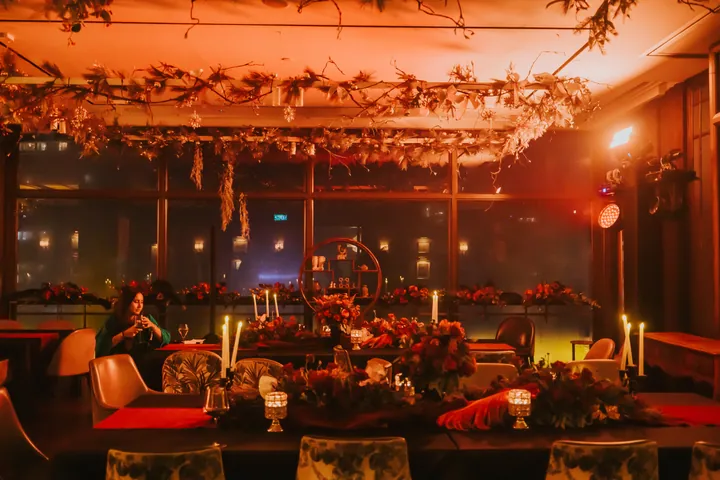 New Year's Eve 2024 · Masquerade: Candlelit dining tables under a hanging foliage canopy