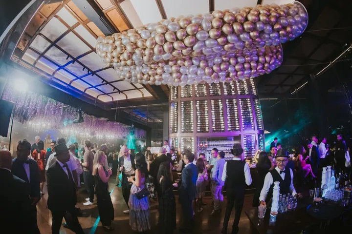 New Year's Eve 2025 · Wisteria: Gold balloon cloud and wisteria over the full room