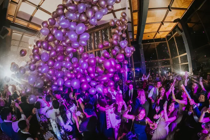 New Year's Eve 2025 · Wisteria: Purple balloon drop over the dance floor
