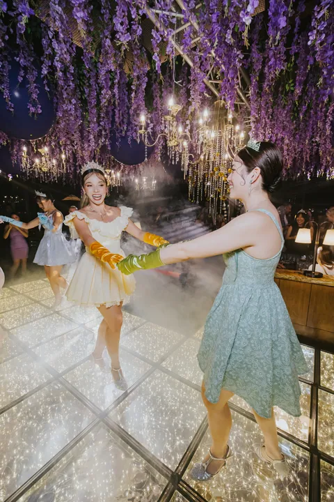 New Year's Eve 2025 · Wisteria: Dancers on the illuminated floor beneath the wisteria