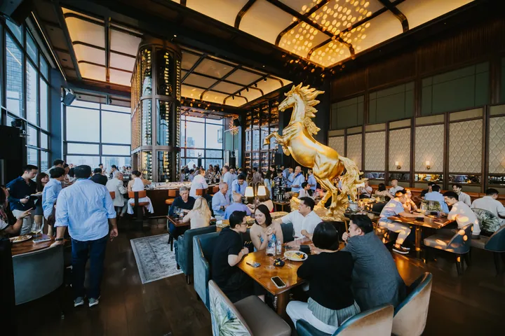 Summer Party 2026: The main room filled, the gold horse at its centre