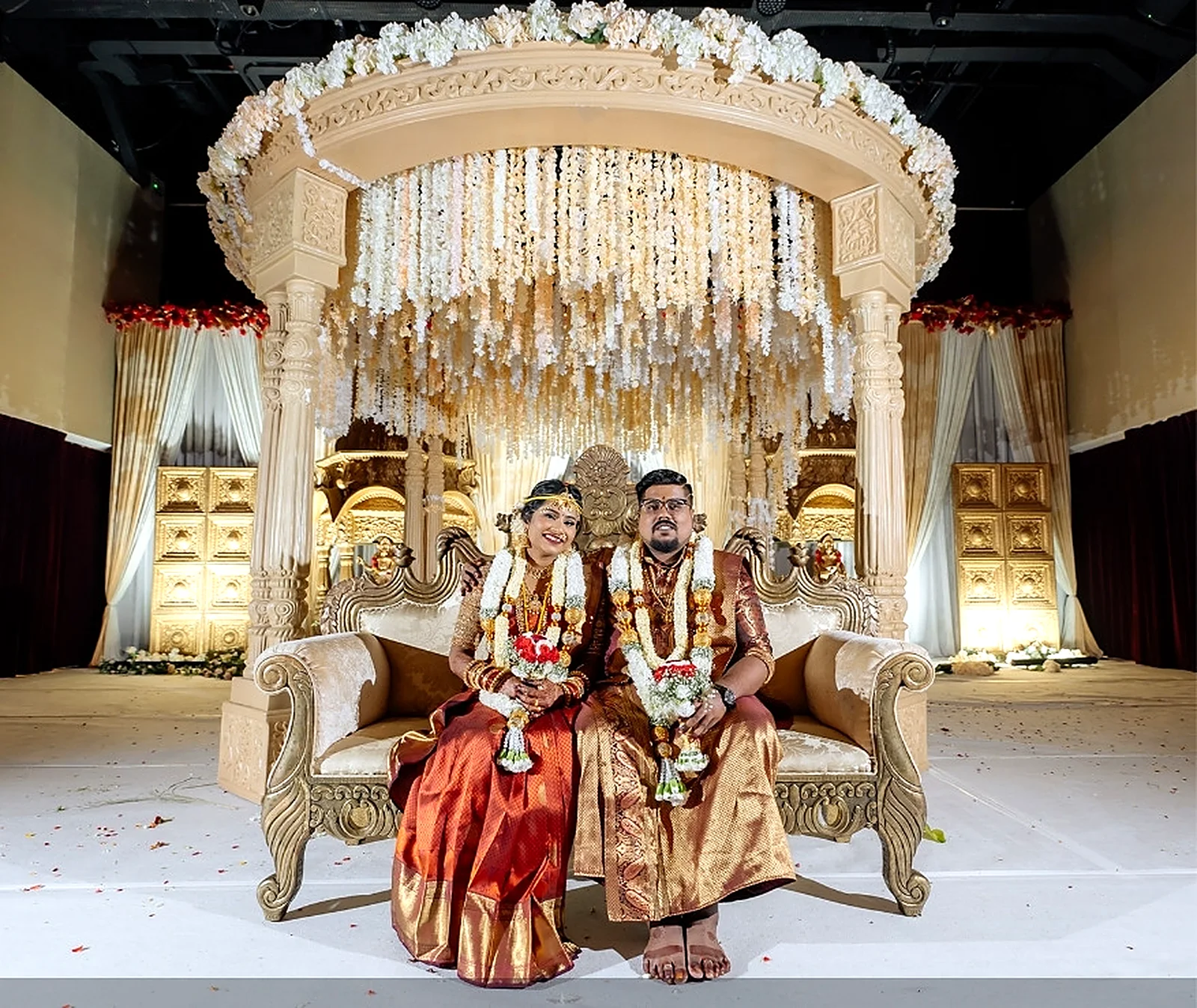 Ivory double pillar mandap dressed in jasmine