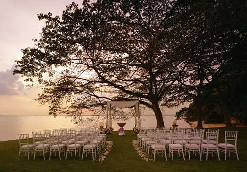 Ceremony chairs on Rasa Lawn at sunset