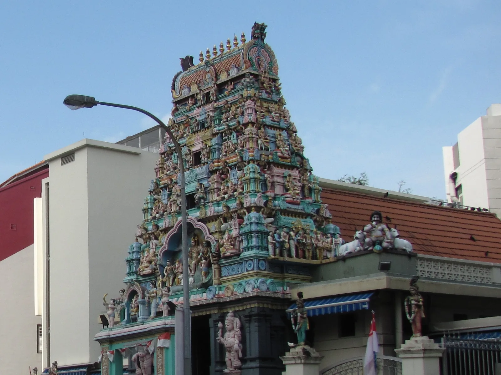 The colourful rajagopuram of Sri Layan Sithi Vinayagar Temple on Keong Saik Road, under a blue sky